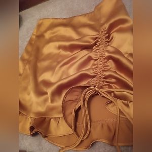 NWOT DollsKill gold satin mini skirt